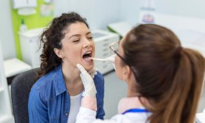 What are the Signs of Infection after Oral Biopsy?